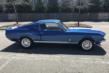 1967 Ford Mustang GT350 tribute restomod in blue with white stripes, side profile